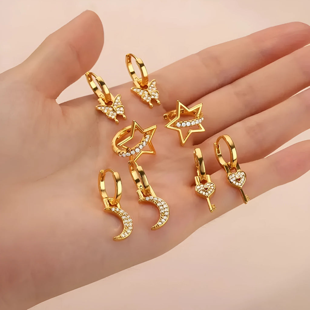 Women's copper geometric butterfly earrings with heart and star motifs in various colours.
