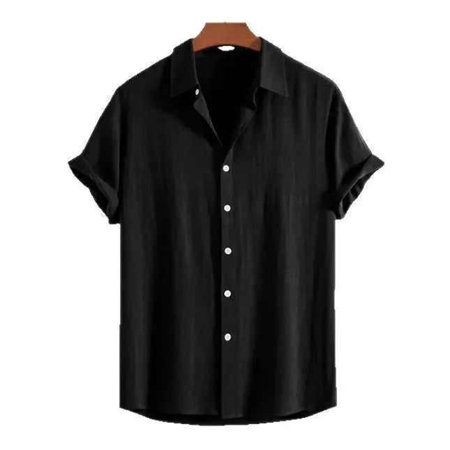 Man wearing a loose black polyester cardigan with short sleeves.