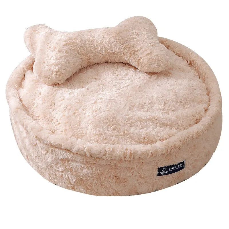 Round nest-style pet bed with a removable washable cover in a milk tea colour.