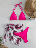 Orange three-piece swimsuit set showing bikini top, bottom, and a loose printed gauze skirt on a mannequin.