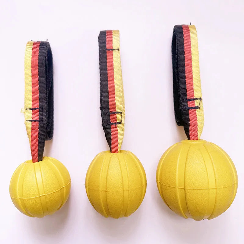 Floating EVA foam dog training ball with string in camouflage or yellow colour, shown in 6.5cm, 7cm, and 9cm diameter sizes
