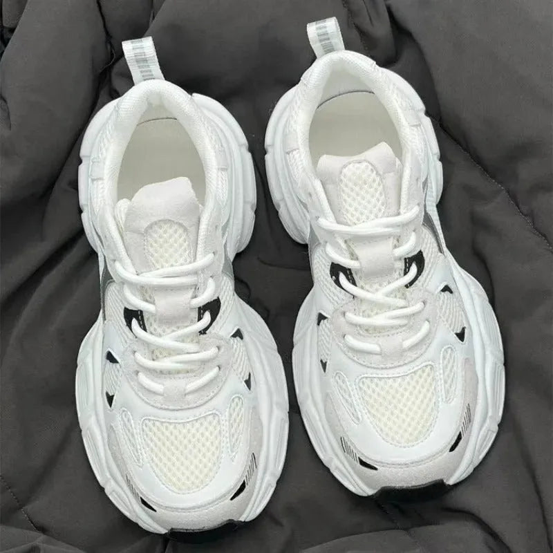 Beige mesh platform sports shoes with a wedge heel and front lace-up fastening.
