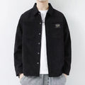 Men's black corduroy cardigan jacket with long sleeves on a hanger.