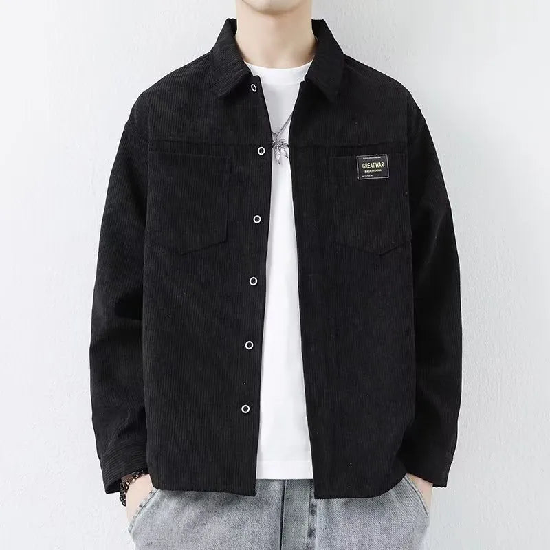 Men's black corduroy cardigan jacket with long sleeves on a hanger.