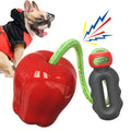 Green apple-shaped plastic dog toy with food-dispensing hole and textured chewable surface