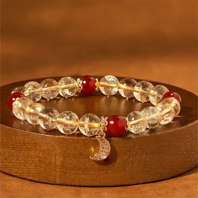 Women's handmade crystal bracelet featuring citrine and red agate beads in a moon boom style.