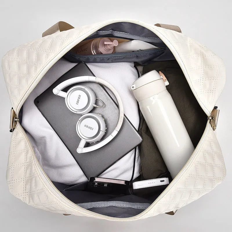Large Oxford cloth travel holdall in a solid colour, shown with a capacity of 36-55 litres for buggies and luggage.