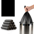 Roll of thickened black disposable plastic bags with flat-mouth design for household use.