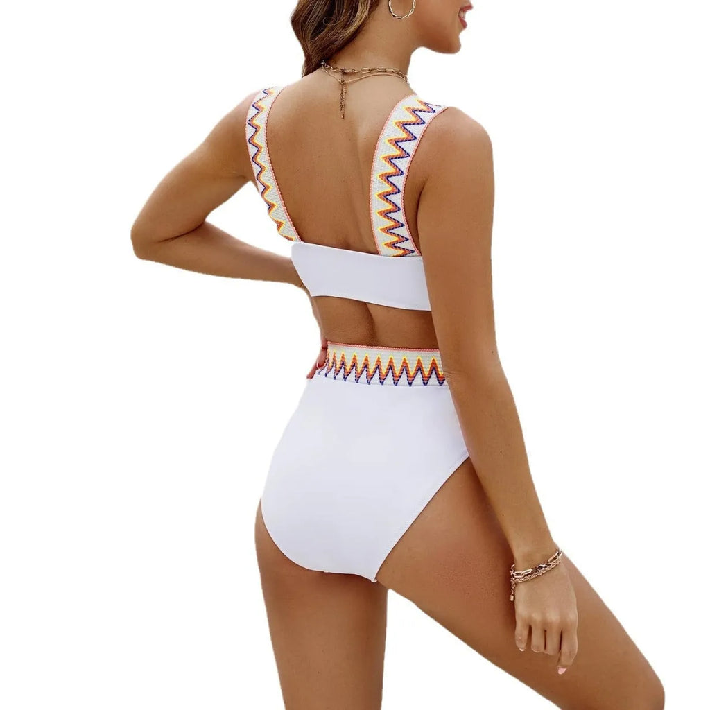 Black and white women's lace-up bikini with high-waisted briefs on a mannequin.