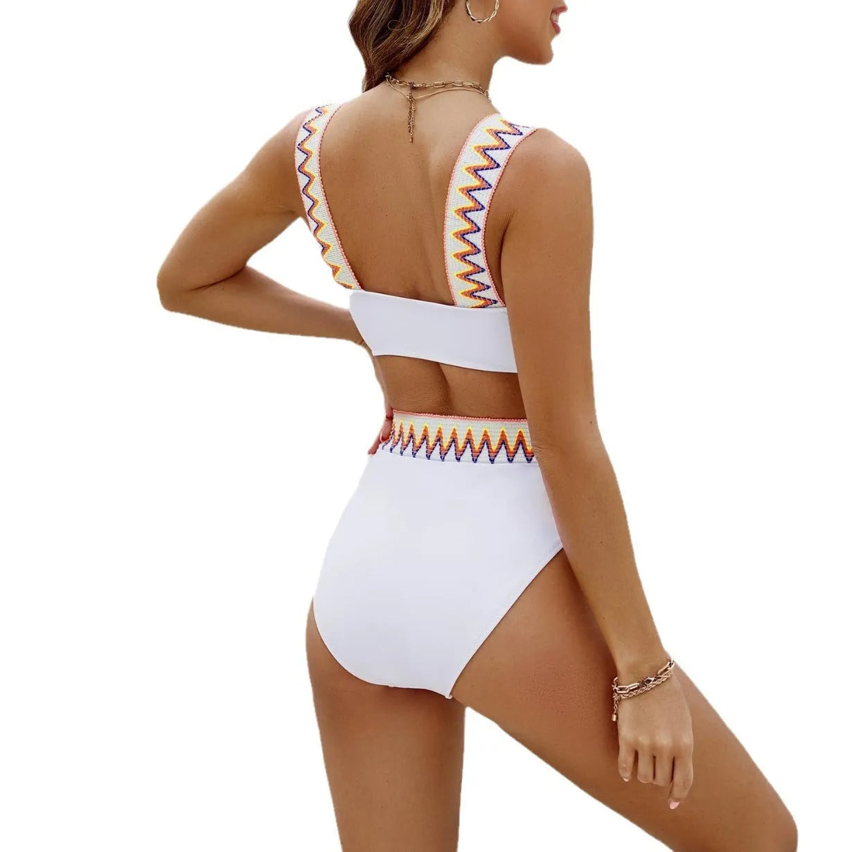 Black and white women's lace-up bikini with high-waisted briefs on a mannequin.