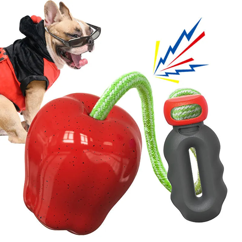 Green apple-shaped plastic dog toy with food-dispensing hole and textured chewable surface