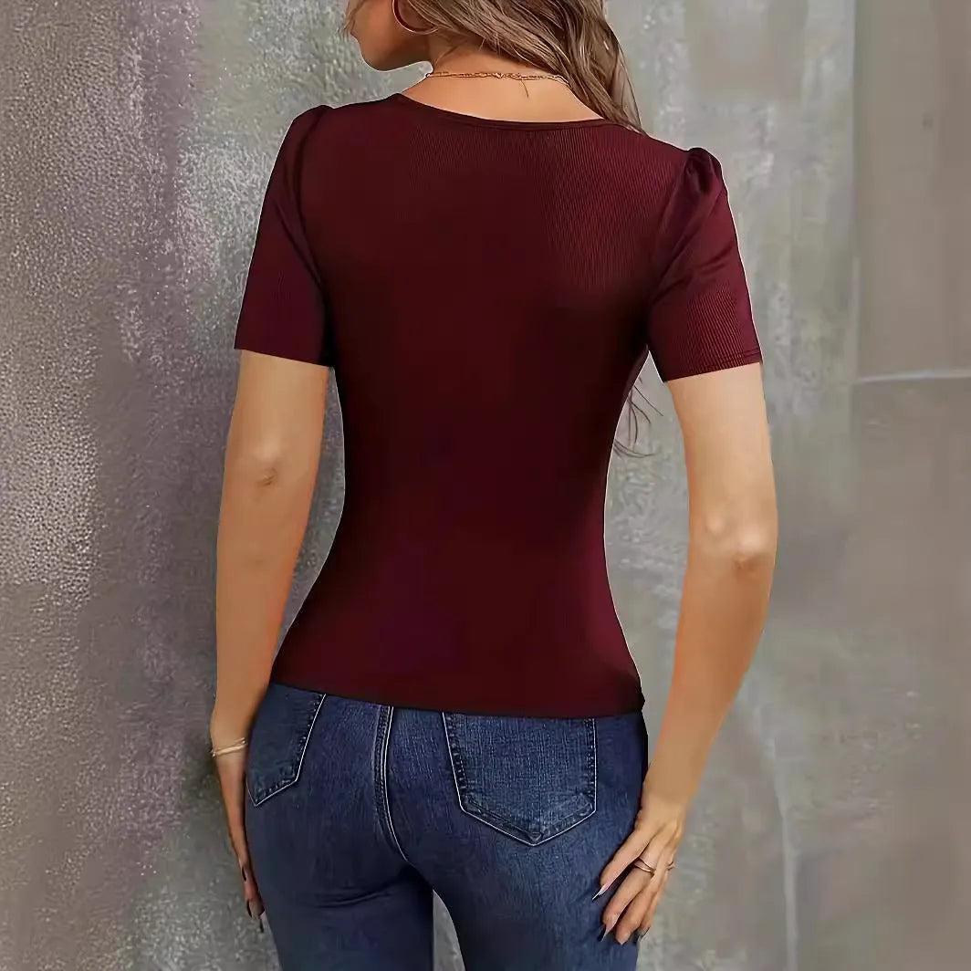 Women's wine red knitted short sleeve top with low neckline and slim fit.