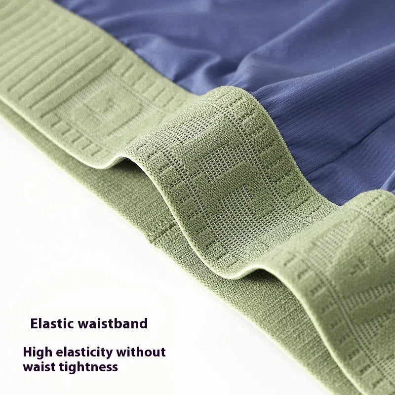 Men's seamless polyester low-waist shorts in light green, loose fit, summer homewear