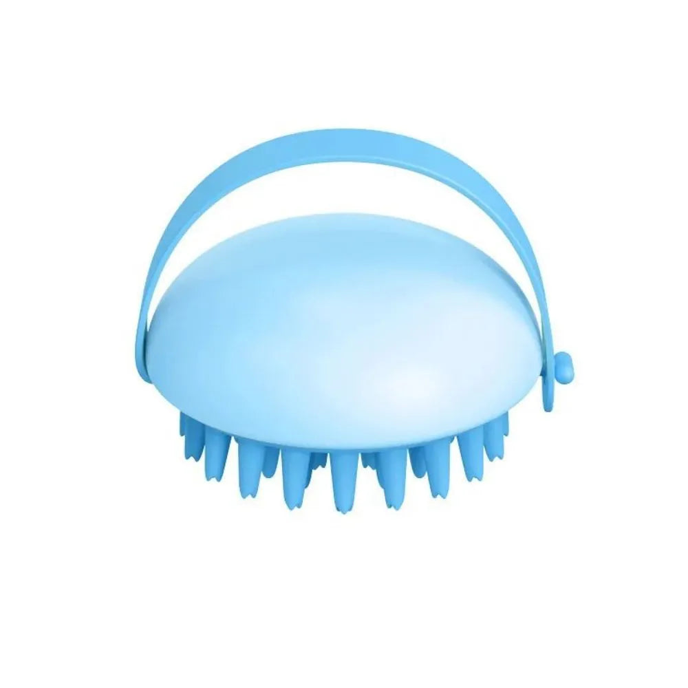 A blue silicone pet bathing brush with soft bristles and a palm-grip base for washing dogs and cats.