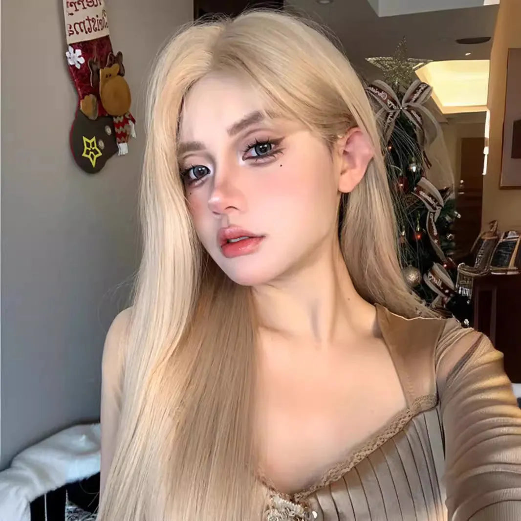 Long straight synthetic wig in milk tea blonde gold colour with hair net on display