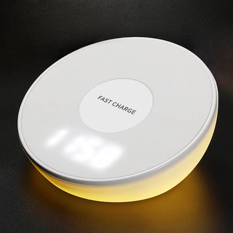 White wireless charging pad with clock display and control buttons for smartphone charging