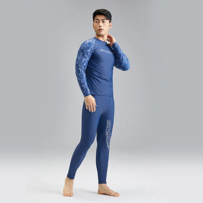 Men's dark blue nylon swimwear set with pattern detail showing swim top and trunks