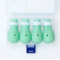 Four green silicone cat anti-scratch foot covers for pet handling protection