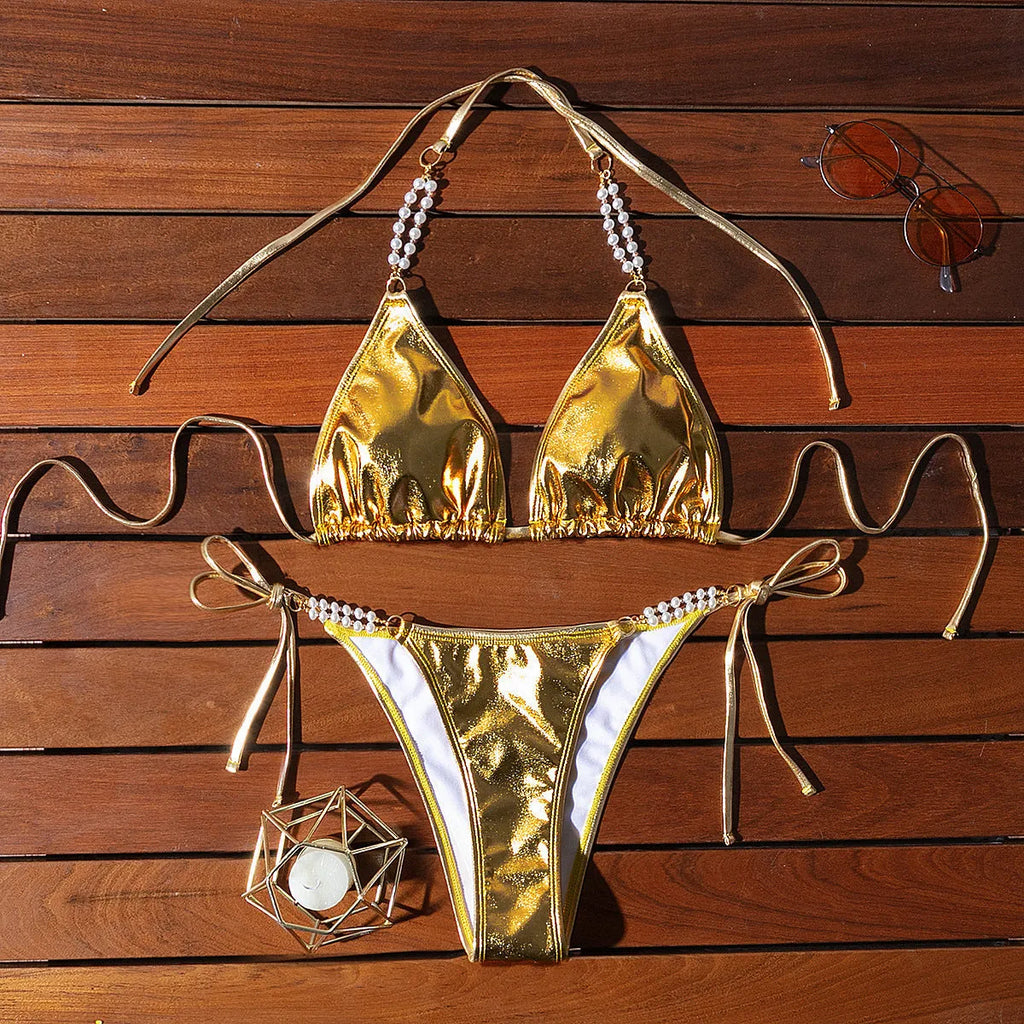 Gold halter lace-up bikini swimsuit with pearl chain detail, shown in Asian sizes
