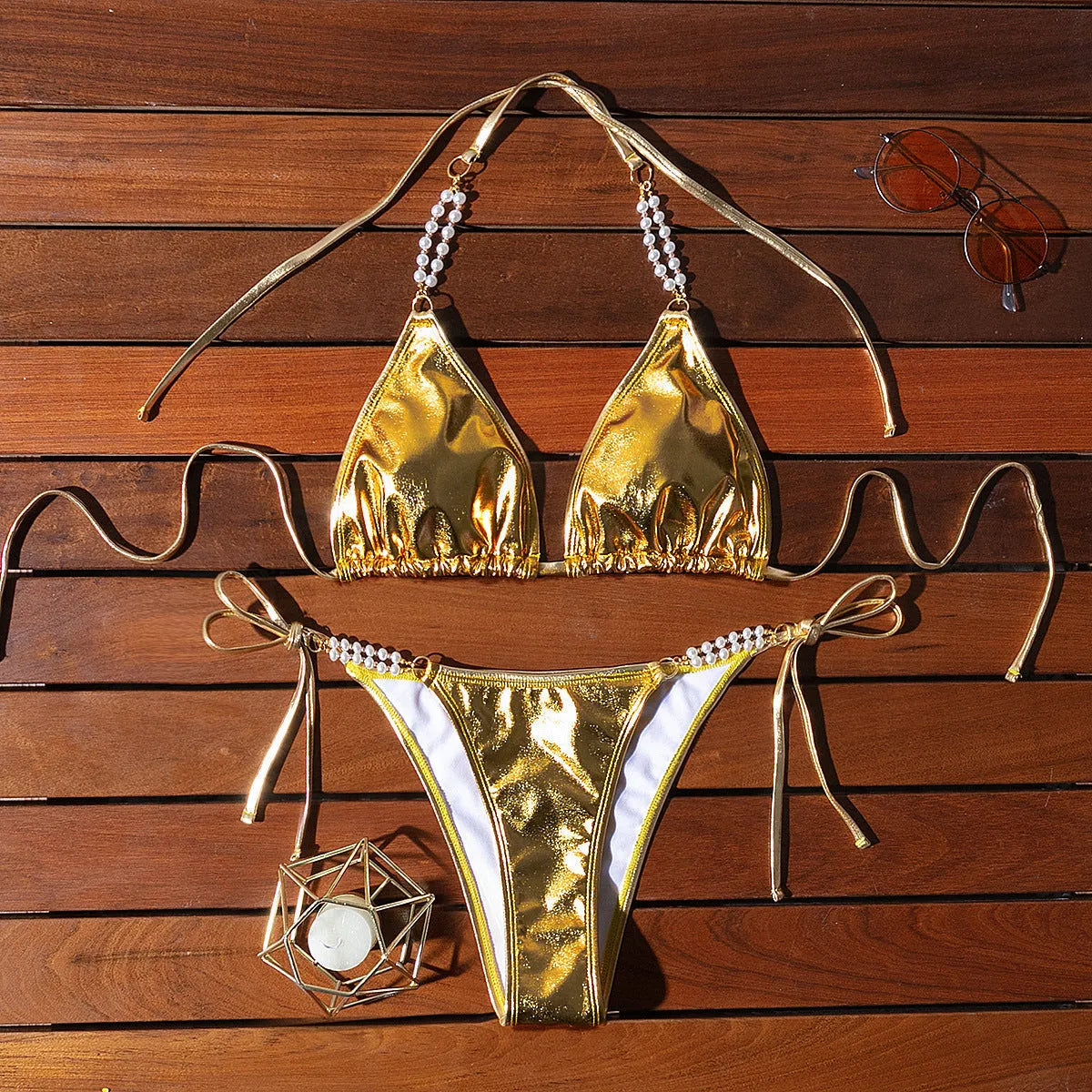 Gold halter lace-up bikini swimsuit with pearl chain detail, shown in Asian sizes