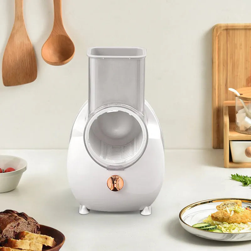 White electric vegetable slicer with rotary blade system and suction base for kitchen food preparation