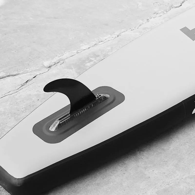 Plastic water dispenser paddle with large removable fish fins attached.