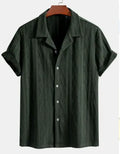 Man wearing a loose black polyester cardigan with short sleeves.