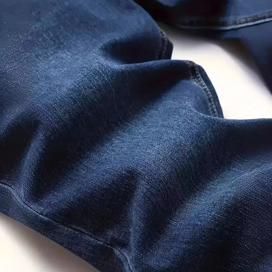Men's dark blue skinny-fit casual jeans with a zip fly on a mid-waist.