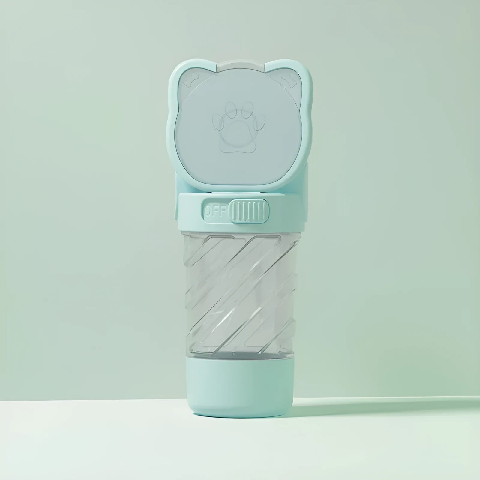 Green 3-in-1 portable pet water bottle with attached bowl, food container, and waste bag dispenser.