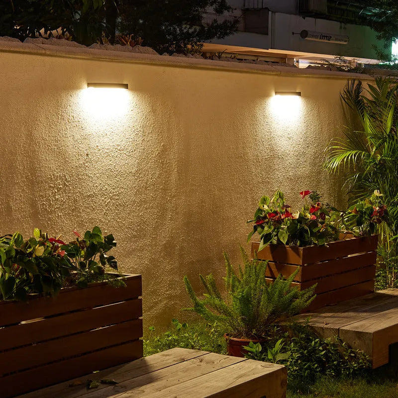 Black ABS plastic solar-powered outdoor wall strip light with IP65 rating.