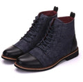 Men's black leather motorcycle boots with silver belt buckle detailing on the shaft.