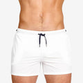 Pair of solid colour sports shorts with mesh lining for swimming and fitness training.