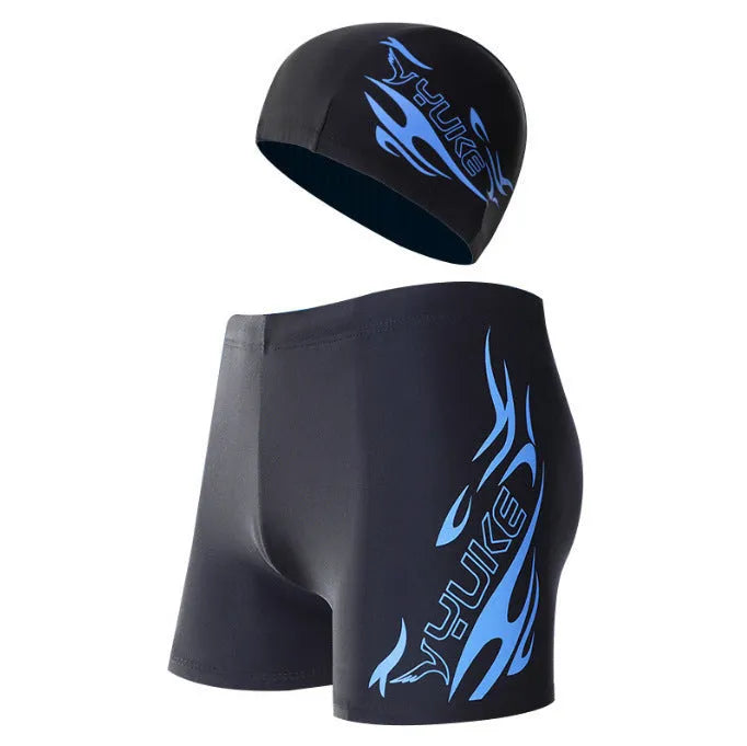 Men's plus size blue fire pattern boxer swimming trunks and matching swimming cap laid flat.