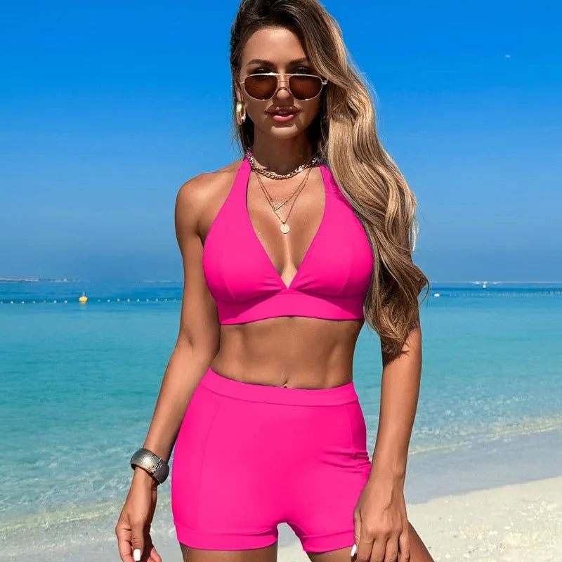 Women's black bikini swimsuit laid flat, showing the two-piece sleeveless design.