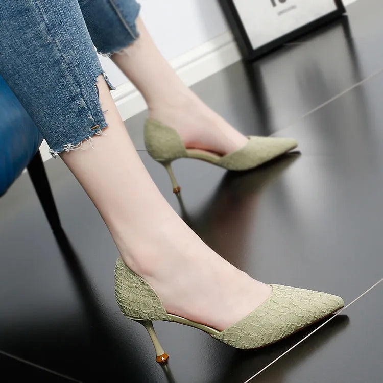 Women's black pointed toe stiletto high heel shoes with a 6-8cm heel on a rubber sole.