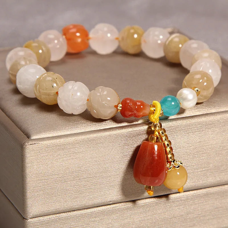 Women's yellow agate crystal bracelet with gold silk cord in adjustable khaki design