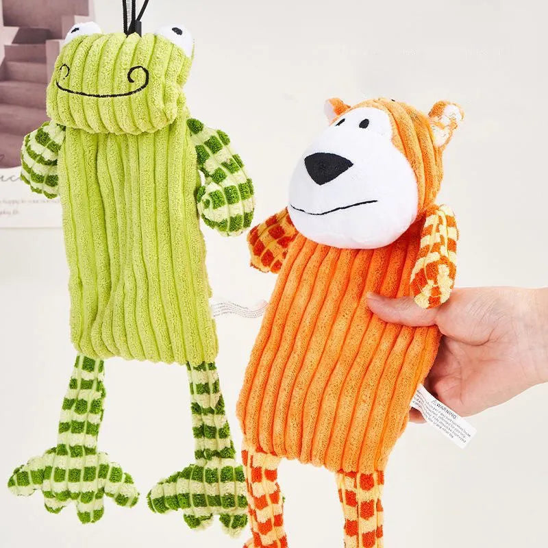 Green and orange 4-inch plush dog toy with squeaker for aggressive chewers
