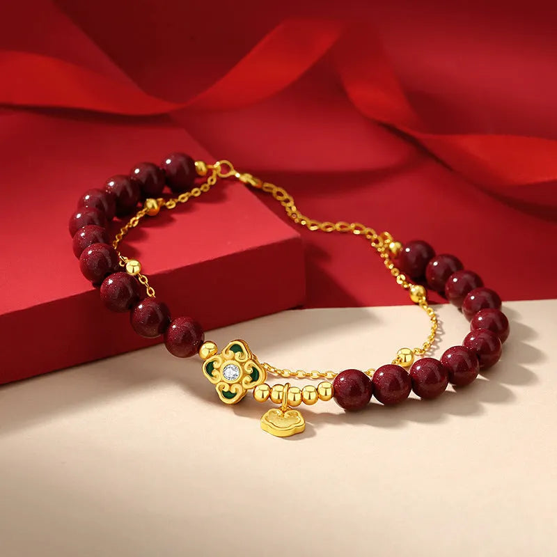 Sterling silver women's bracelet with geometric Ruyi and Xiangyun Chinese motifs and cinnabar red flower detailing