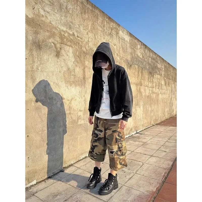 Men's camouflage cropped pants with ripped patches and straight leg cut