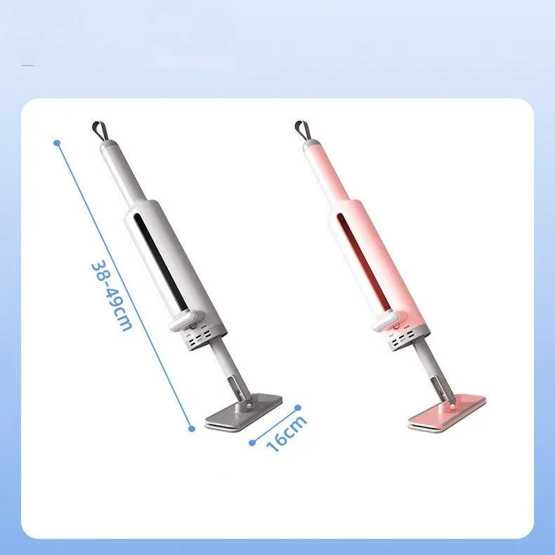 Pink rotatable self-squeeze flat mop with microfiber pad extended on a floor.