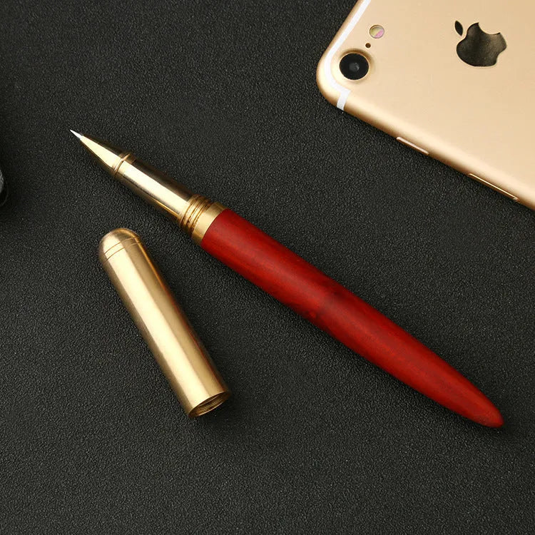 Brass and solid wood signature pen showing wood grain and metal components