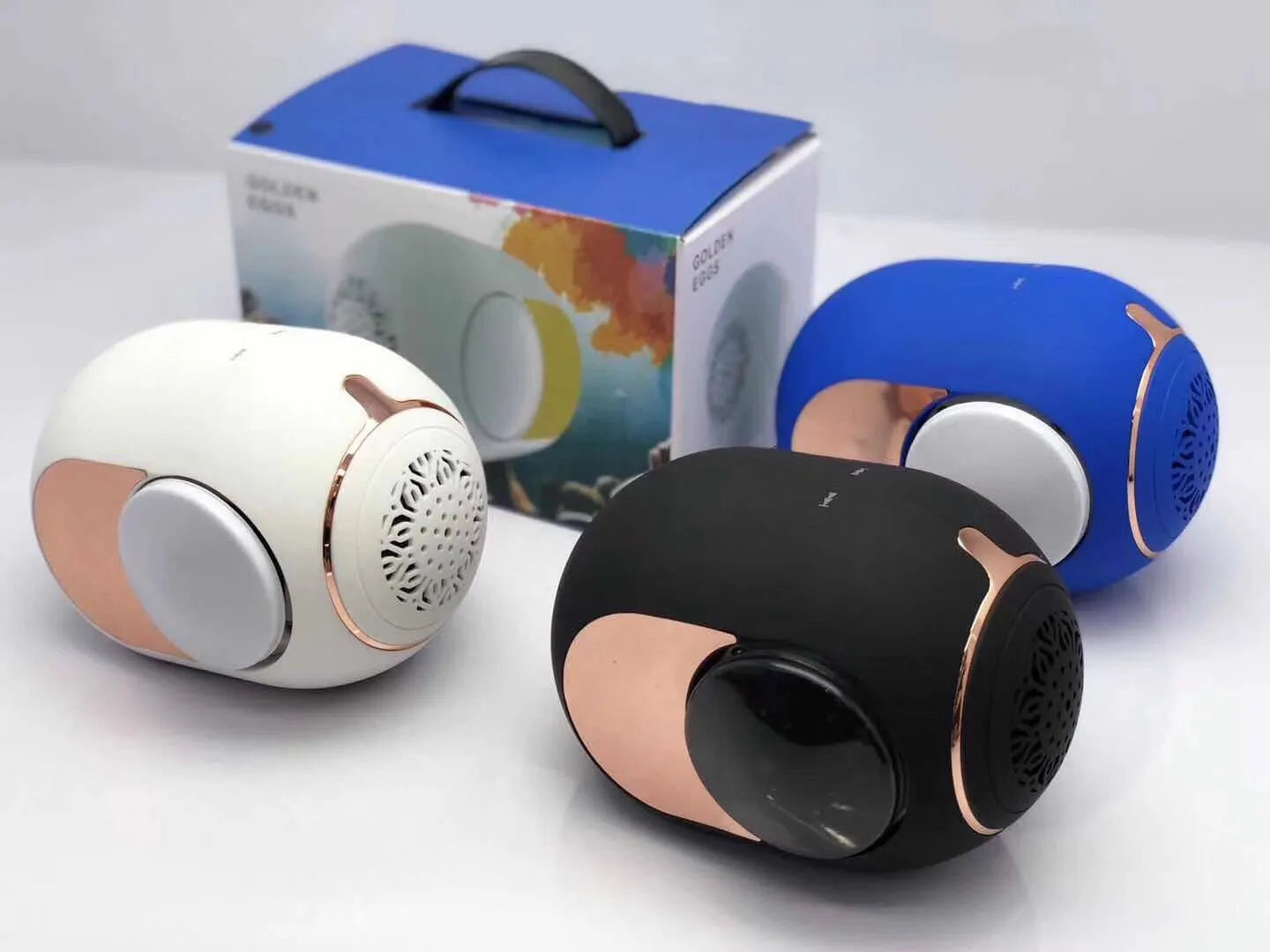 Small golden egg shaped wireless Bluetooth speaker in black, white or blue with compact portable design