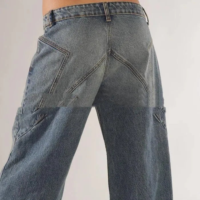 Women's loose blue cotton wide leg trousers with colour block panelling on a low waist.