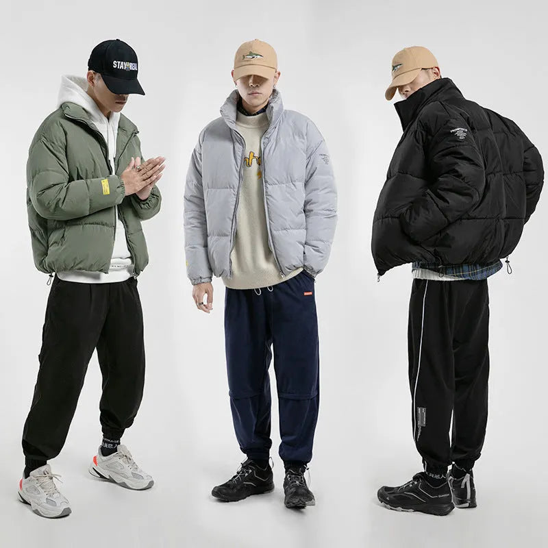 Men's stand collar padded jacket in black, polyester filling, zipper front, side slit pockets, straight hem, loose fit
