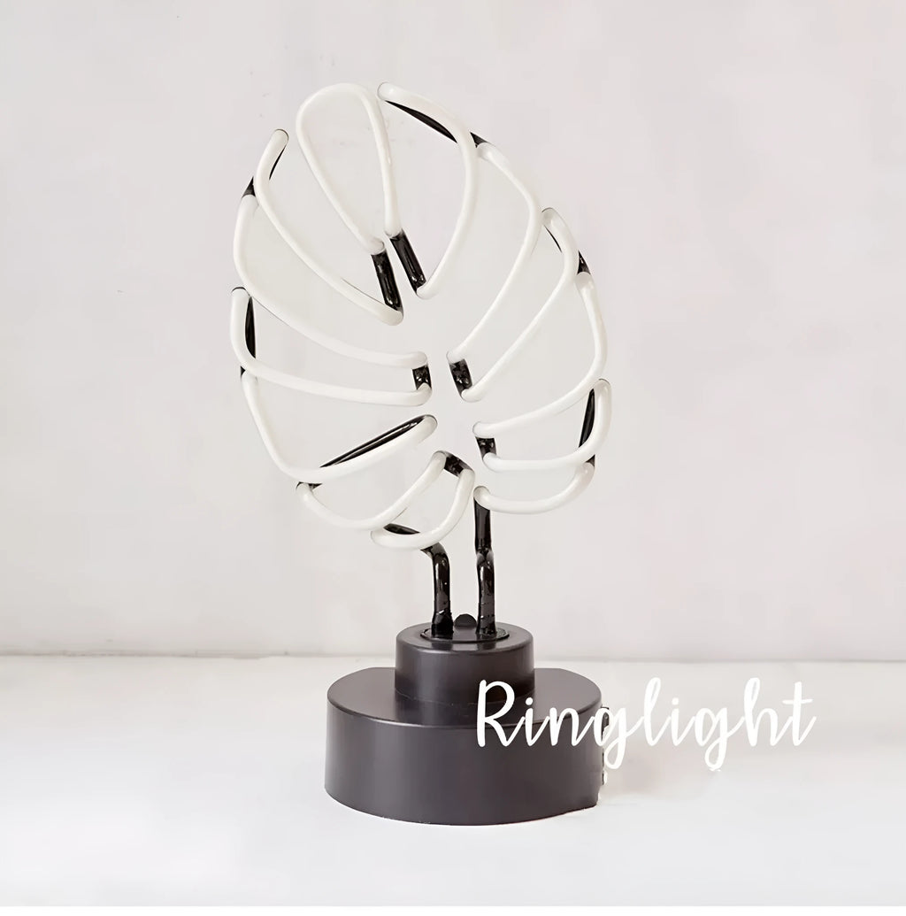 Handmade white bamboo-shaped desk lamp emitting green light, shown in two size options.