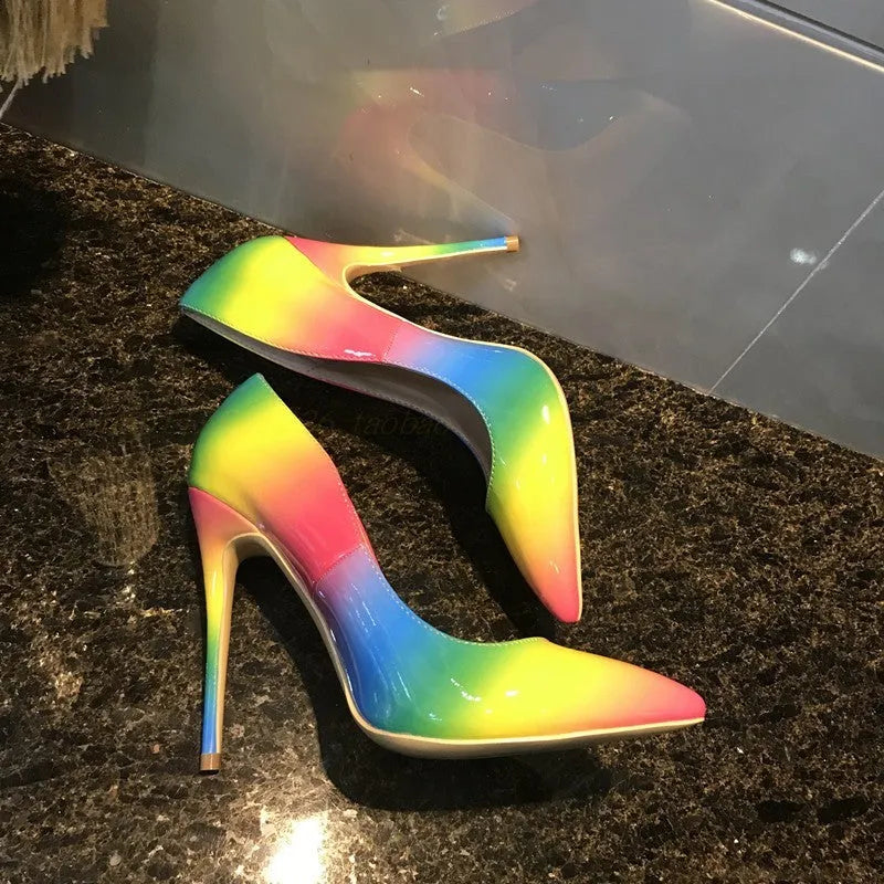 Rainbow multicolour patent leather women's stiletto heels with a pointed toe.