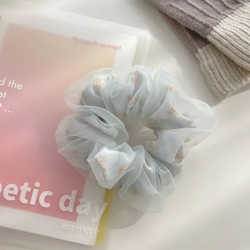 Mesh Sense bun large intestine hair band in milky white, made from soft cloth with a natural style, for women