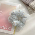 Mesh Sense bun large intestine hair band in milky white, made from soft cloth with a natural style, for women