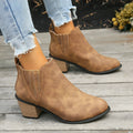 Black women's ankle boot with pointed toe and thick square low heel, slip-on design