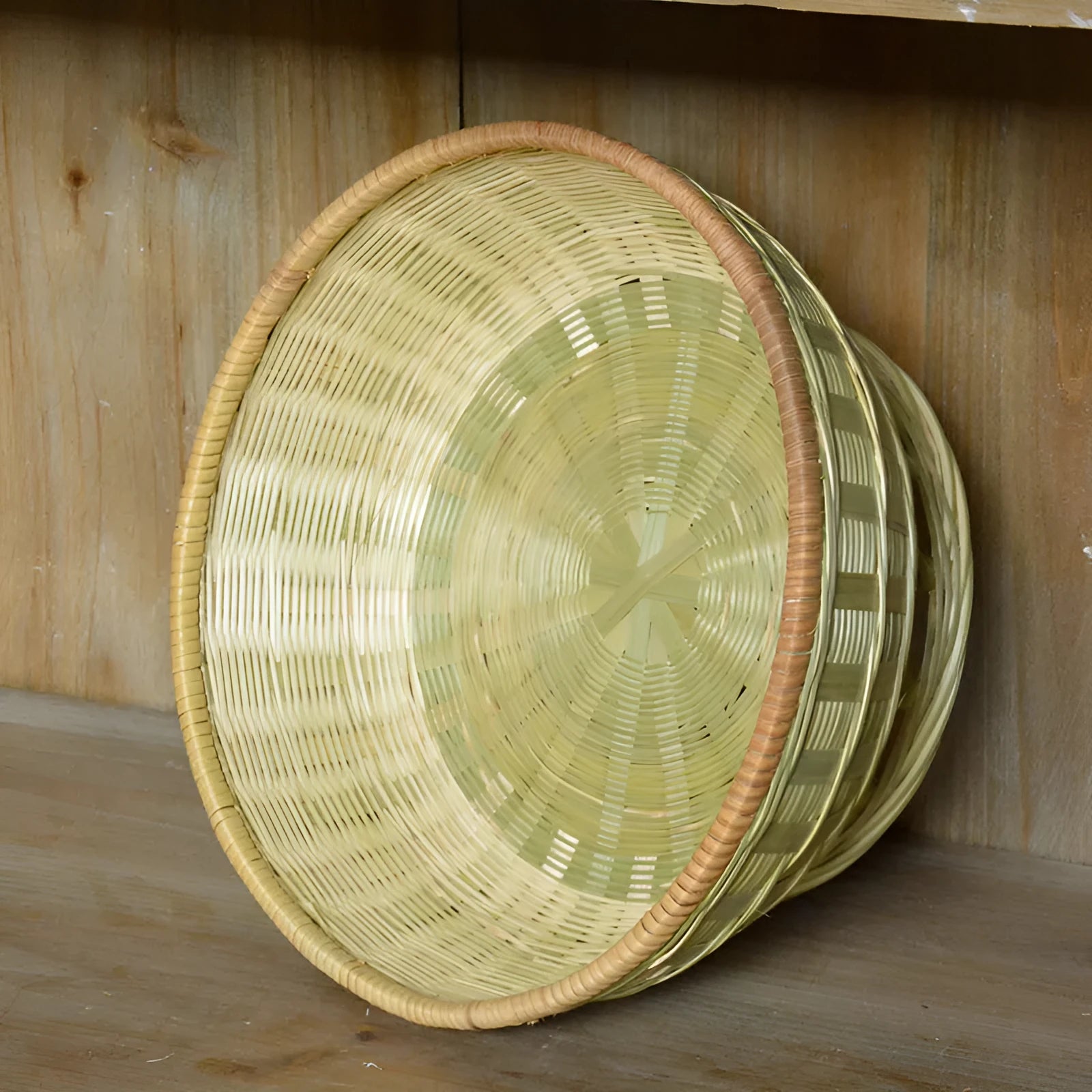 Handmade natural bamboo storage basket with open weave design in three size variations